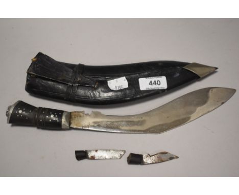 A 20th century Gurkha style Kukri knife in black leather scabbard