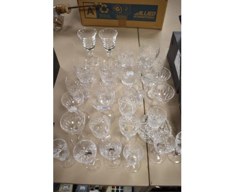 A mixed lot of vintage cut glass and crystal, including etched champagne glasses, tumblers and wine glasses.