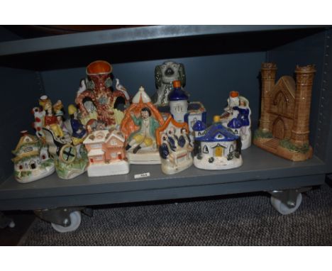 A selection of vintage and antique Staffordshire flat backs including Pastille burners, Spill vases and figures