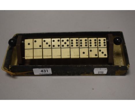 A vintage Avago domino game set with partial box.