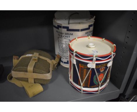 A vintage military water flask and a Military, Kings own border reg drum Ice Bucket