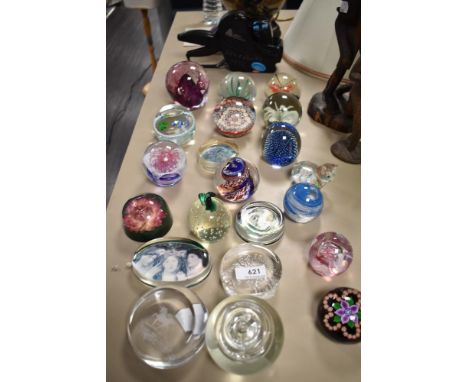 A selection of modern art glass paper weights including millefiori, lamp worked and hand blown.