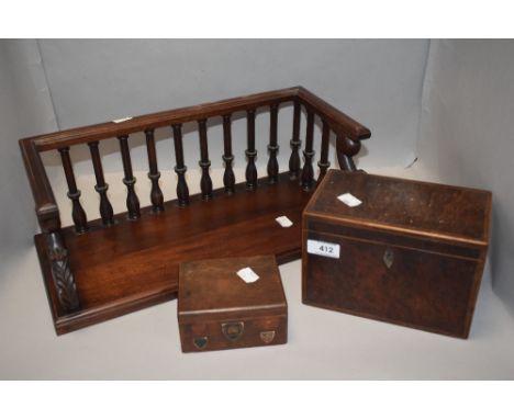 A fine early 20th century book shelf with turned and carved rails, a birds eye burr wood cased tea caddy missing interior and