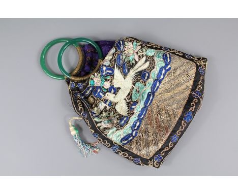 A Chinese Silk Embroidered Bag. The bag with handle double circular handle of green jade-effect glass, approx 32 x 25 cms, em