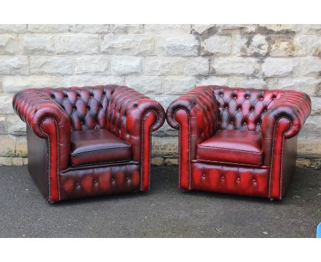 A Pair of Claret Leather Button Back Club Chairs in the Chesterfield style.