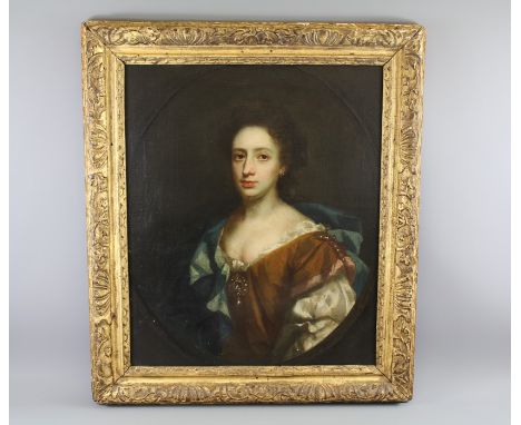 Circle of Sir Peter Lely R.A.(1618-1680) Oil on Canvas. Three Quarter Portrait of a Lady, the lady seated draped in a red and