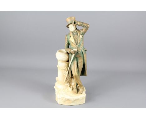 A Continental Ceramic Figurine of an 18th Century Style Man: the man leaning on a jardiniere with a walking stick in his righ