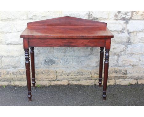 An Edwardian Mahogany Console Table, approx 105 cms l x 53 d x 105 cms h on turned legs.