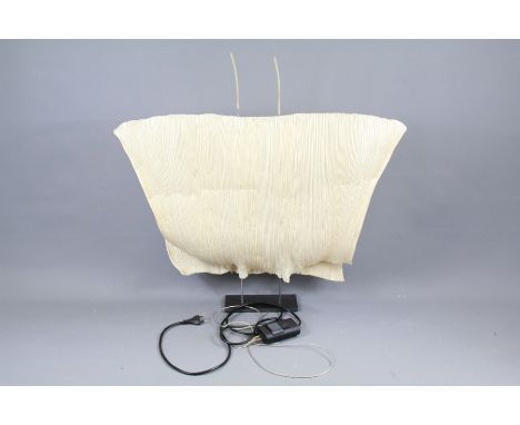 An Ingo Maurer Samurai Japanese Paper Lamp. The lamp shade is finely pleated paper, simple frame on black metal support, the 