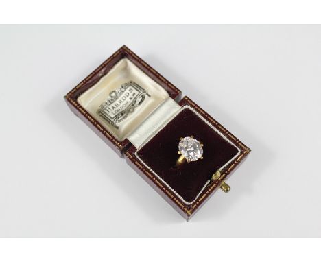 A Lady's 9ct Gold and CZ Ring. The ring size K, approx 4.7 gms, presented in a Harrods box.