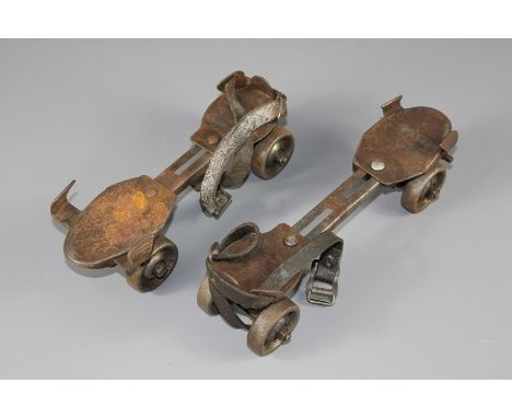 A Pair of 1950's Roller Skates. The skates having strap and key fitting.&nbsp;