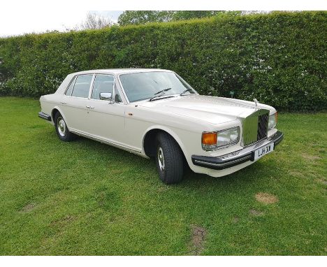 A Classic Rolls Royce Silver Spirit. In porcelain white over tan leather. MOT until February 2020.Paperwork including old bil