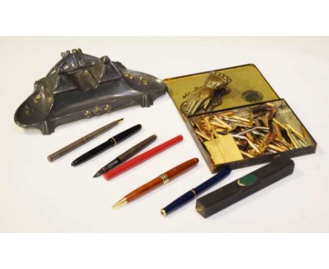 Art Nouveau influence pewter desk stand, small collection of 20th Century fountain and other pens, pen nibs, etc.