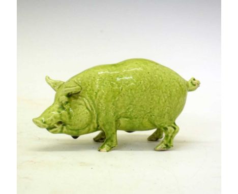 Early 20th Century green glazed model of a Sussex pig, inscribed marks 'Rd 352044', 19cm longAll of the trotters have some le