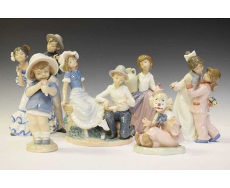Nao - Six porcelain figures to include; a dancing couple, clown, girl with urn, etc., 27cm high and smallerAll of the pieces 