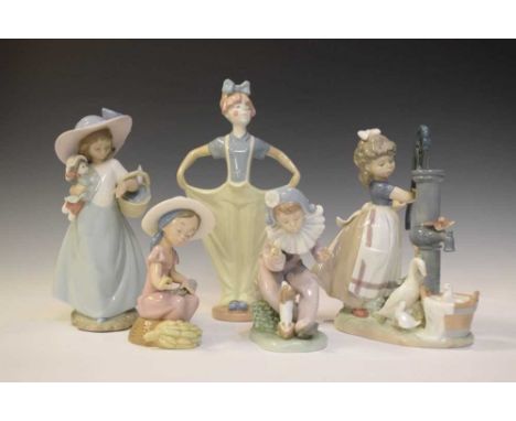 Lladro porcelain figure of a girl at a water pump with geese, 24cm high, together with four Nao figures (5)