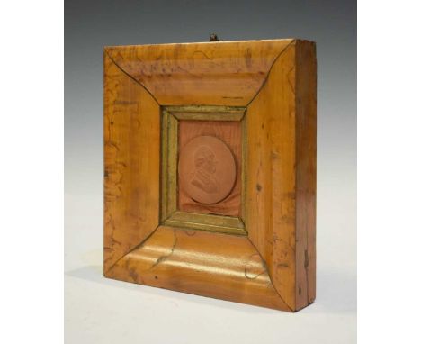 Terracotta or stoneware portrait medallion, probably representing George III, 42mm diameter, on moire silk backing within bur