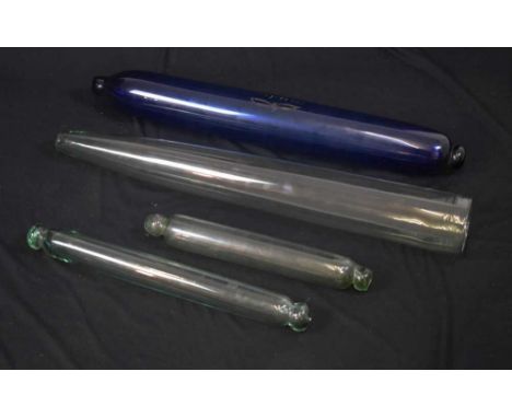 Rare Victorian glass cucumber straightener, 71cm long, a large 'Bristol' blue lgass rolling pin, 66cm, and two smaller clear 