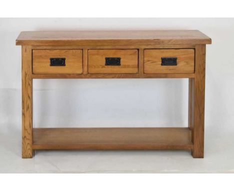 Modern light oak three drawer console table, 119cm x 35cm x 77cm high 