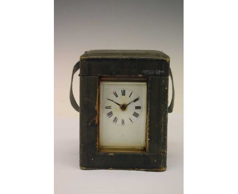 Brass cased carriage clock, white Roman dial, single train movement, with key, and with travel box