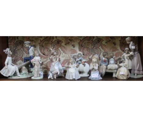 A shelf containing a selection of Lladro and Nao porcelain figurines (9) Condition: Overall good no visible cracks, chips, or