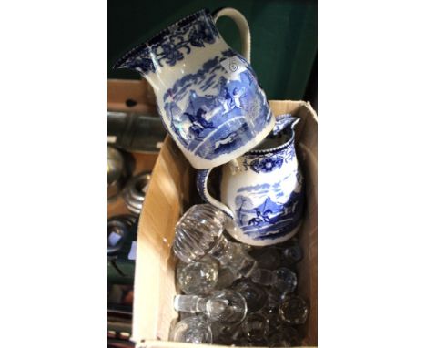 A pair of 19th century blue and white transfer printed ceramic jugs, decorated with Tiger Hunt designs, 12cm high, together w