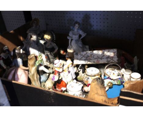 A box containing a wide selection of ceramic figurines including two Beswick Beatrix Potters