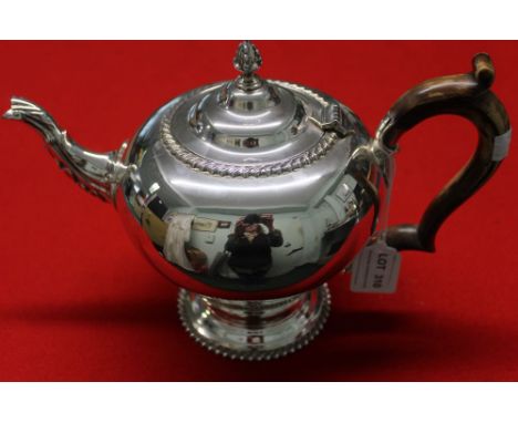 Garrard &amp; Co. A Georgian design silver teapot, cast acanthus leaf decoration to spout, gadrooned rims, having vase finial