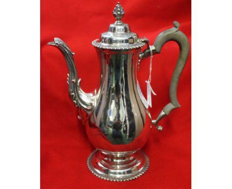 Garrard &amp; co. A Georgian&nbsp; design silver coffee pot, teardrop form with cast acanthus leaf decoration to the spout, g