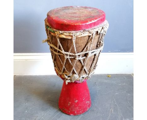 African tribal red painted wooden drum with plaited string tensioners with woven cloth detail 56cm high x 26cm diameter - sig