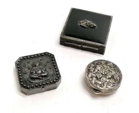 Chinese silver box with buddha detail to lid, silver pill box with grape detail to lid &amp; German silver black enamel compa