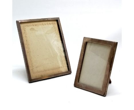 2 x antique silver fronted photograph frames with wooden easel stand backs - largest 21.5cm x 16.5cm ~ both have some dents 