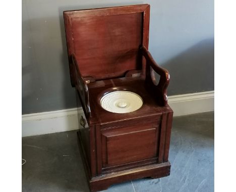 Edwardian mahogany commode with folding arms, ceramic liner and lid, liner a/f, 49.5 cm wide, 46 cm deep. 51 cm high, good co
