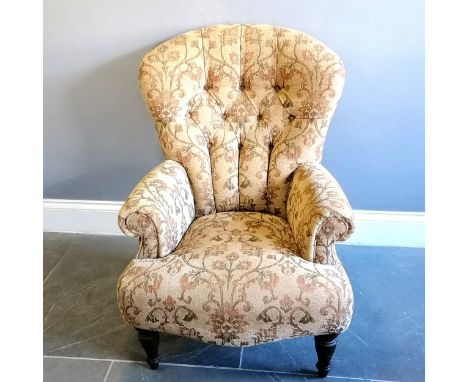 Victorian style button back armchair upholstered in a floral tapestry beige coloured material, in good used condition, 78 cm 