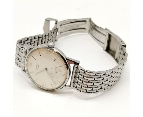 Longines 1960's stainless steel manual wind wristwatch (32mm case) with original winding crown and running (tested for 4 days