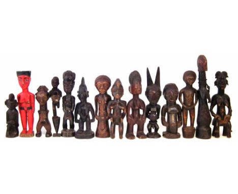 Fourteen African figures carved in various tribal styles, the largest measures 30cm high     All lots in this Tribal and Afri