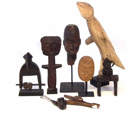 Collection of items, to include a Dogon head, a small panel carved with an alligator, an Asante doll, Lobi slingshot, Yaka pi