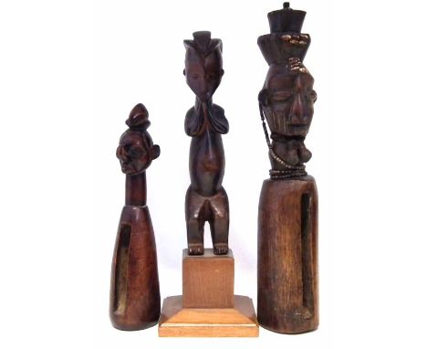 Two Yaka slit gongs and a Suku standing figure, the largest gong measures 50cm high     All lots in this Tribal and African A