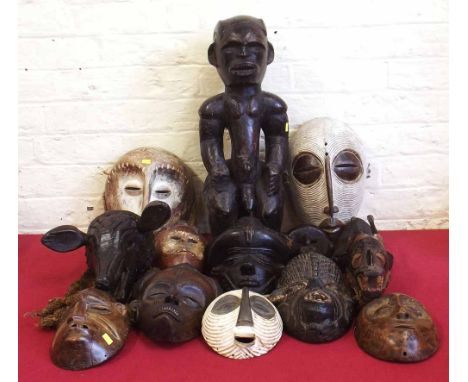 Collection of African masks carved in various tribal styles.    Please note this lot is not subject to VAT on the hammer pric