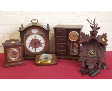 Cuckoo clock and three mantel clocks and barometers. Condition report: see terms and conditions