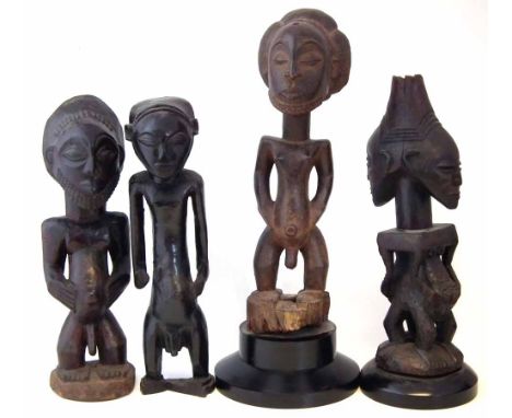 Four Luba / Hemba figures, the largest measures 54cm high     All lots in this Tribal and African Art Sale are sold subject t