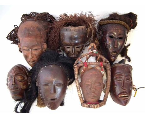 Seven Masks carved in Chokwe and similar tribal styles, the largest measures 35cm high     All lots in this Tribal and Africa