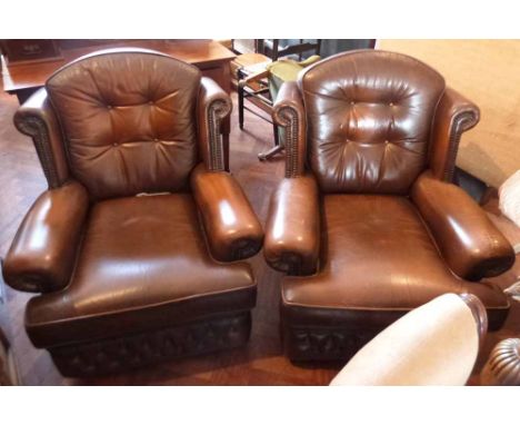 Pair of modern leather button back easy chairs. Condition report: see terms and conditions