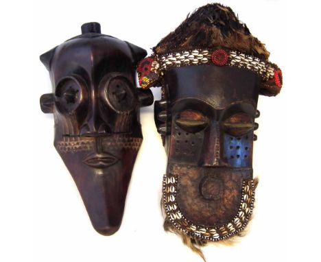 Two Kuba Kete masks, the largest measures 48cm high     All lots in this Tribal and African Art Sale are sold subject to V.A.