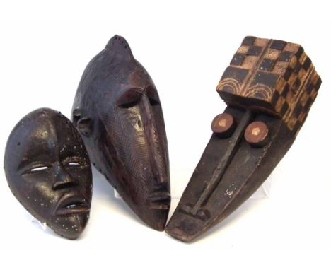 Grebo mask, Baga janus mask and a Dan mask, the largest measures 39cm high     All lots in this Tribal and African Art Sale a
