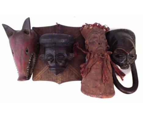 Four Chokwe masks, the largest measures 38cm high     All lots in this Tribal and African Art Sale are sold subject to V.A.T.