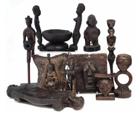 Collection of items carved in the Songye, Chokwe and related tribal styles, to include two headrests, a pipe, two panels, an 