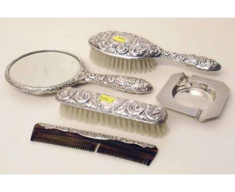 Silver dressing table set comprising two brushes, comb and mirror also an ash tray. Condition report: see terms and condition