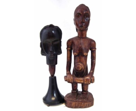 Fang head and one other figure, 64cm high     All lots in this Tribal and African Art Sale are sold subject to V.A.T. Therefo