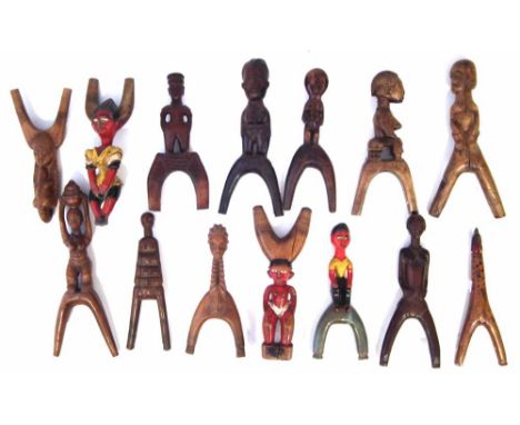 Fourteen sling shots carved in various tribal styles, the largest measures 22cm high     All lots in this Tribal and African 